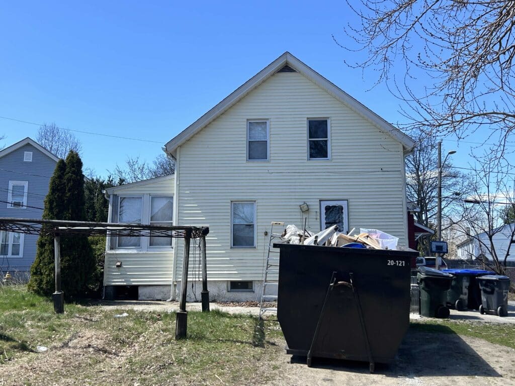 Front of a Providence, RI hoarder house we bought fast with cash.